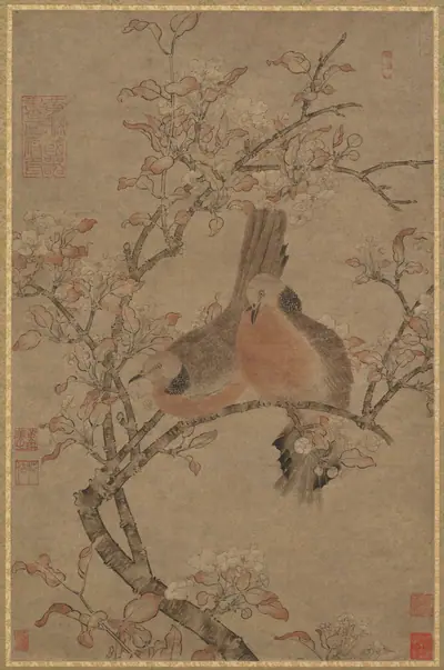 Two doves on a flowering branch
