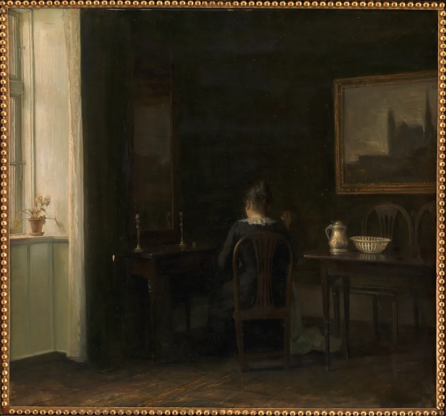 Interiør med kunstnerens hustru Emilie Heise by Carl Holsøe