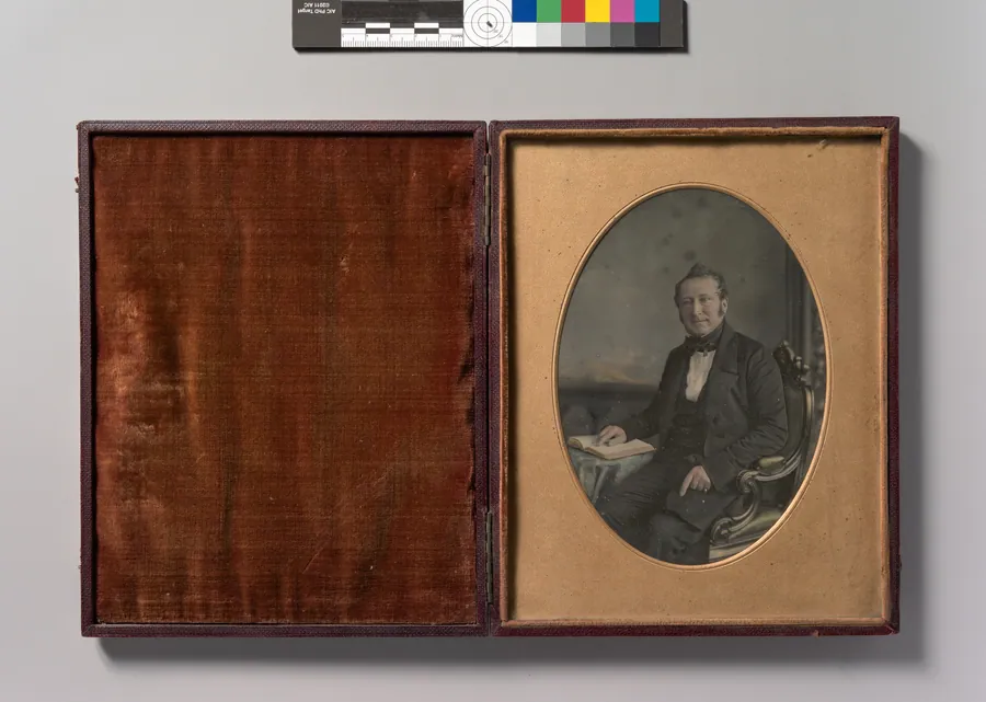 [Seated Man Pointing to a Passage in an Open Book] by John Jabez Edwin Mayall