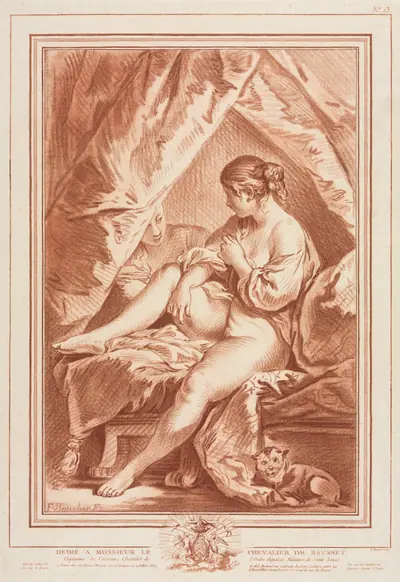 Young Woman Seated on a Bed