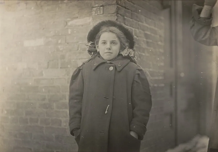 Mery Horn, a hunchback condition aggravated by the heavy load of papers she carried. Hartford, Connecticut, March 1909 by Lewis Wickes Hine