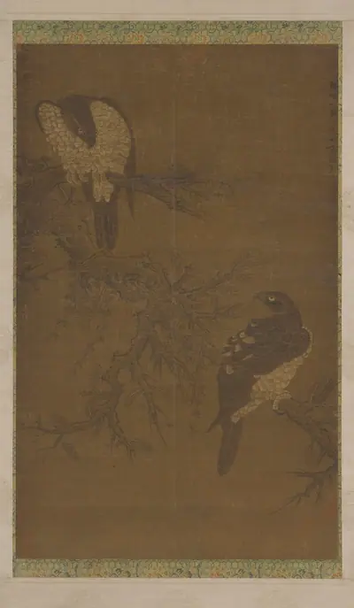 Two hawks on a withered bough