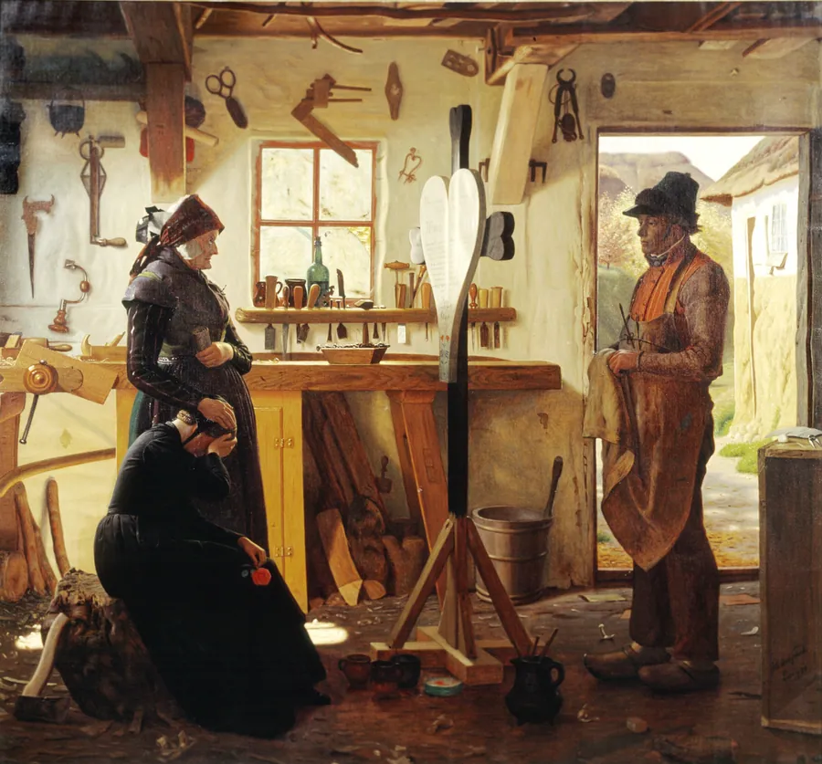 To kvinder besøger landsbykunstneren for at se det bestilte gravkors by Christen Dalsgaard