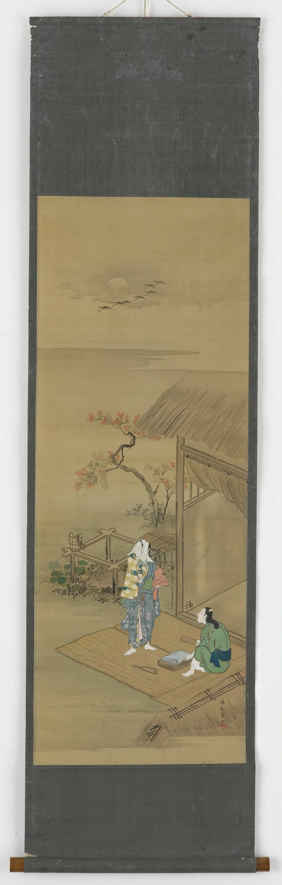 Two peasant girls beating cloth outside a house by Katsukawa Shunsho 勝川春章 (1726-1792)