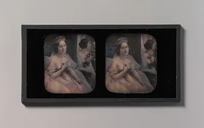 [Stereograph of a Woman Wearing a Tiara and Tulle and Lace Dress, Seated Before a Mirror]