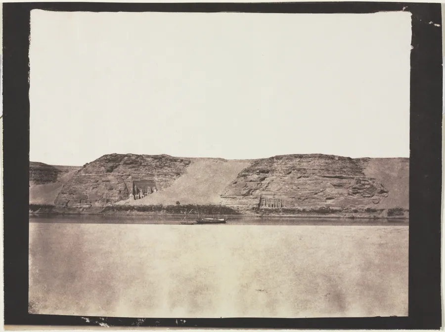 General View of Monuments Carved into Bedrock with Photographer's Dahabieh. Abu Simbel by Félix Teynard
