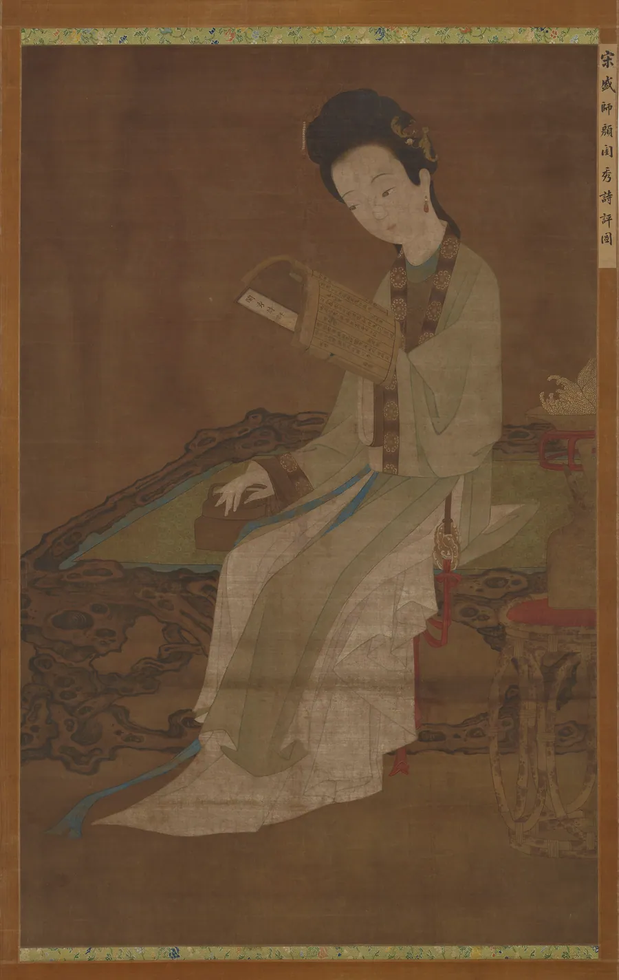 Young woman reading a book of poems by Traditionally attributed to Sheng Shiyan (13th century)