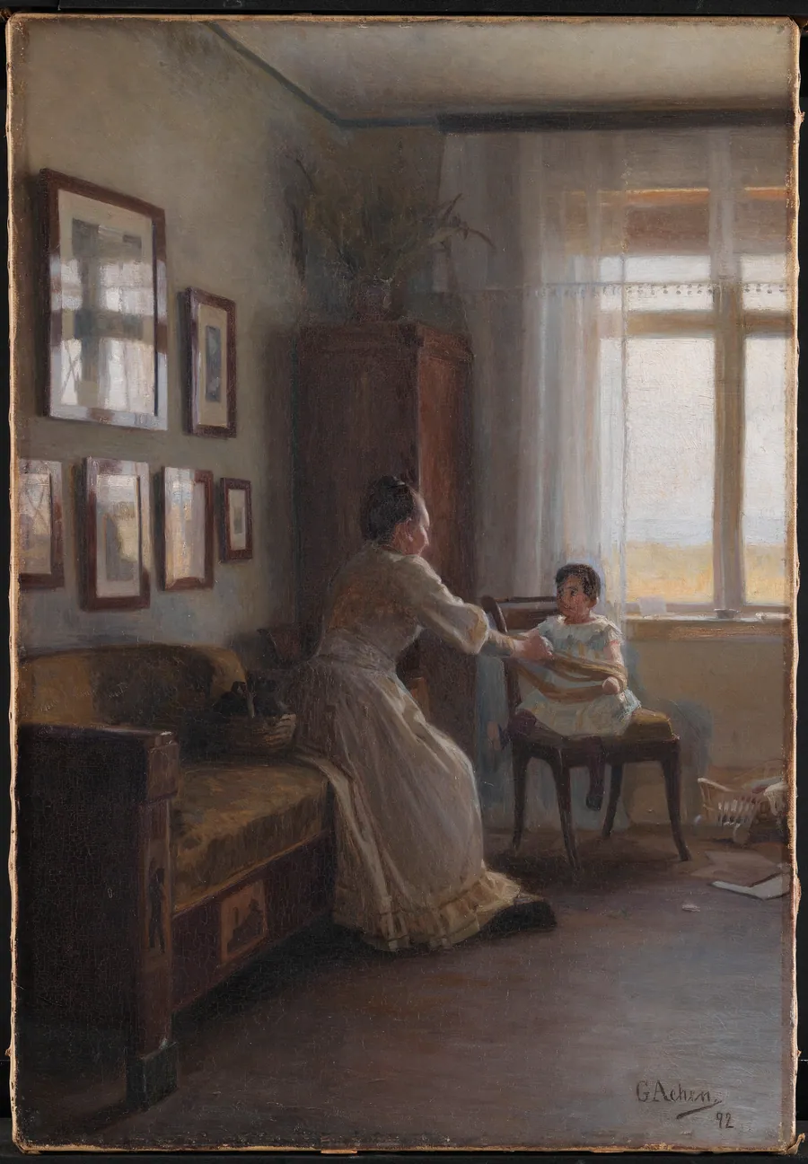 Interiør med kunstnerens hustru og barn by Georg Achen