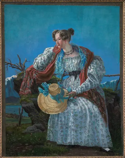 Ung kvinde siddende i et norsk landskab