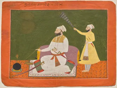 Raja Bikram Singh of Guler smoking a hookah
