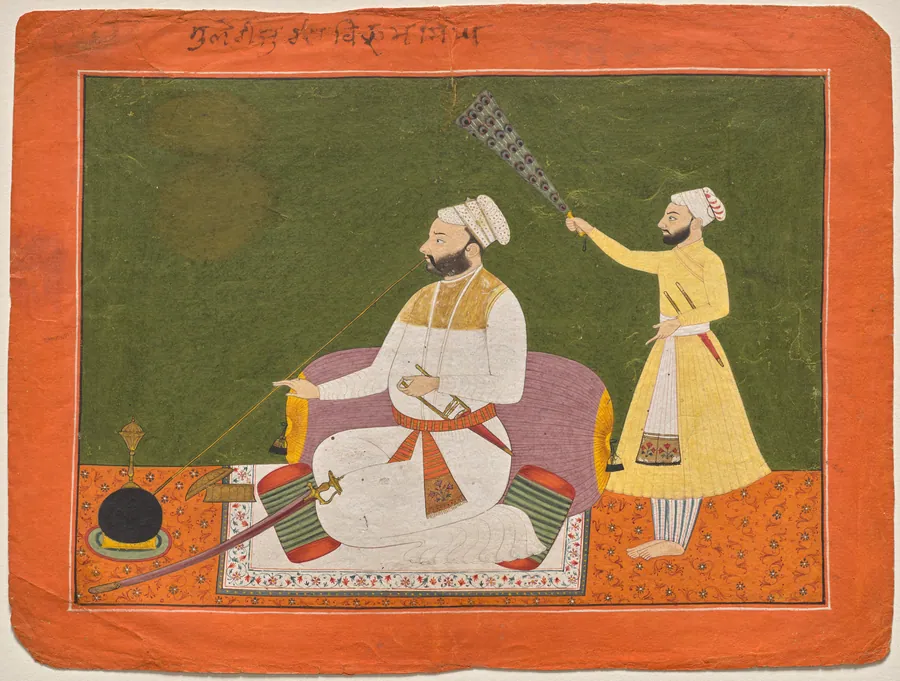 Raja Bikram Singh of Guler smoking a hookah
