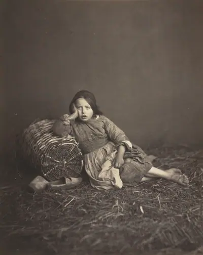 Young Girl Seated on Straw, Leaning on a Basket