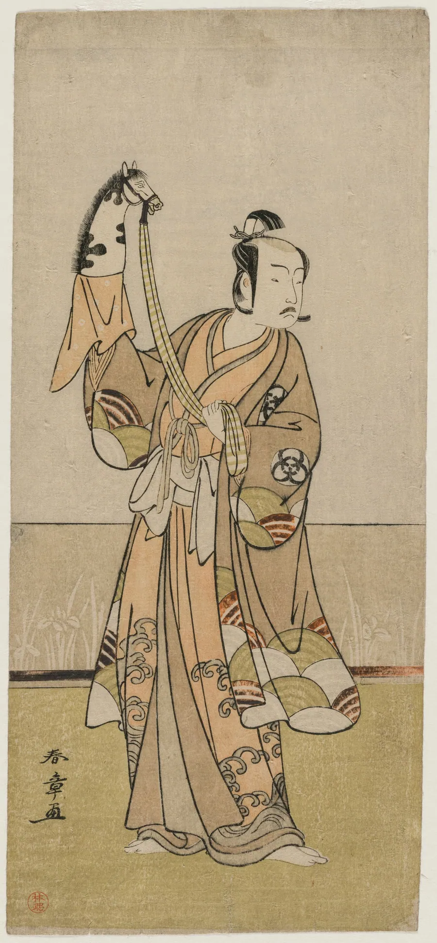 Bando Hikosaburo III Holding a Hand Pupper by Katsukawa Shunshō