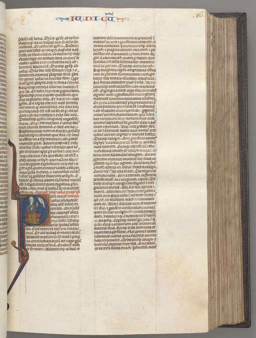 Fol. 86r, Judges, historiated initial R, Judah seated with a book talking to God