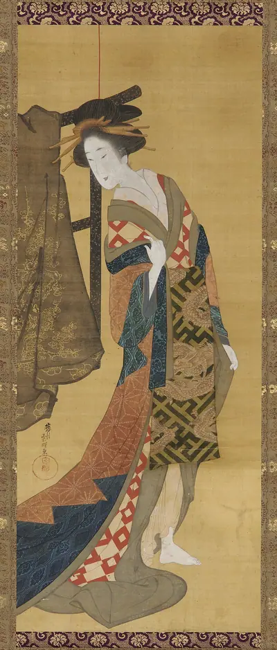 A courtesan standing near a clothes rack