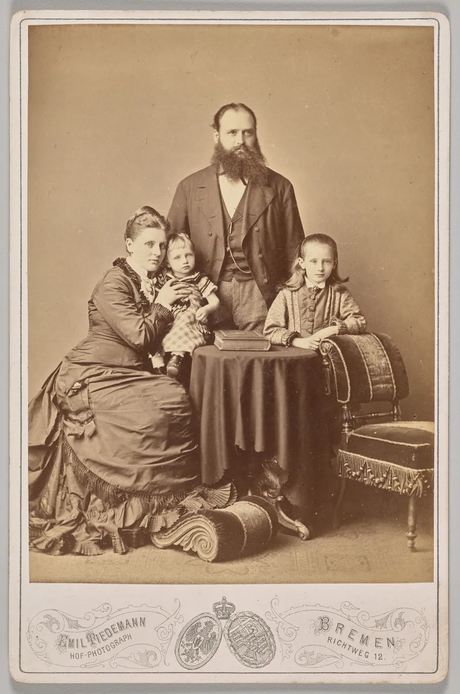 Untitled (studio portrait of a family) by Emil Tiedemann