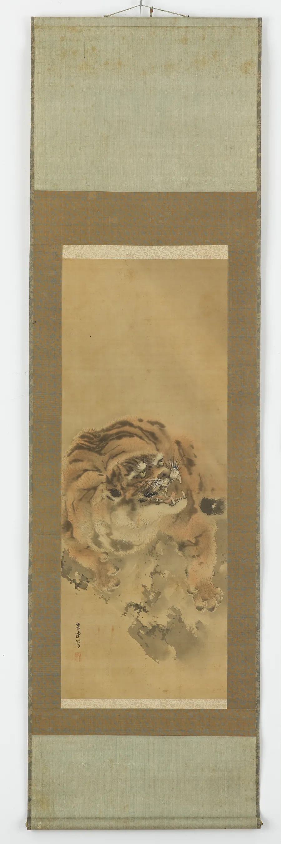 A crouching, snarling tiger by Gantoku Aoki (1804-1859)