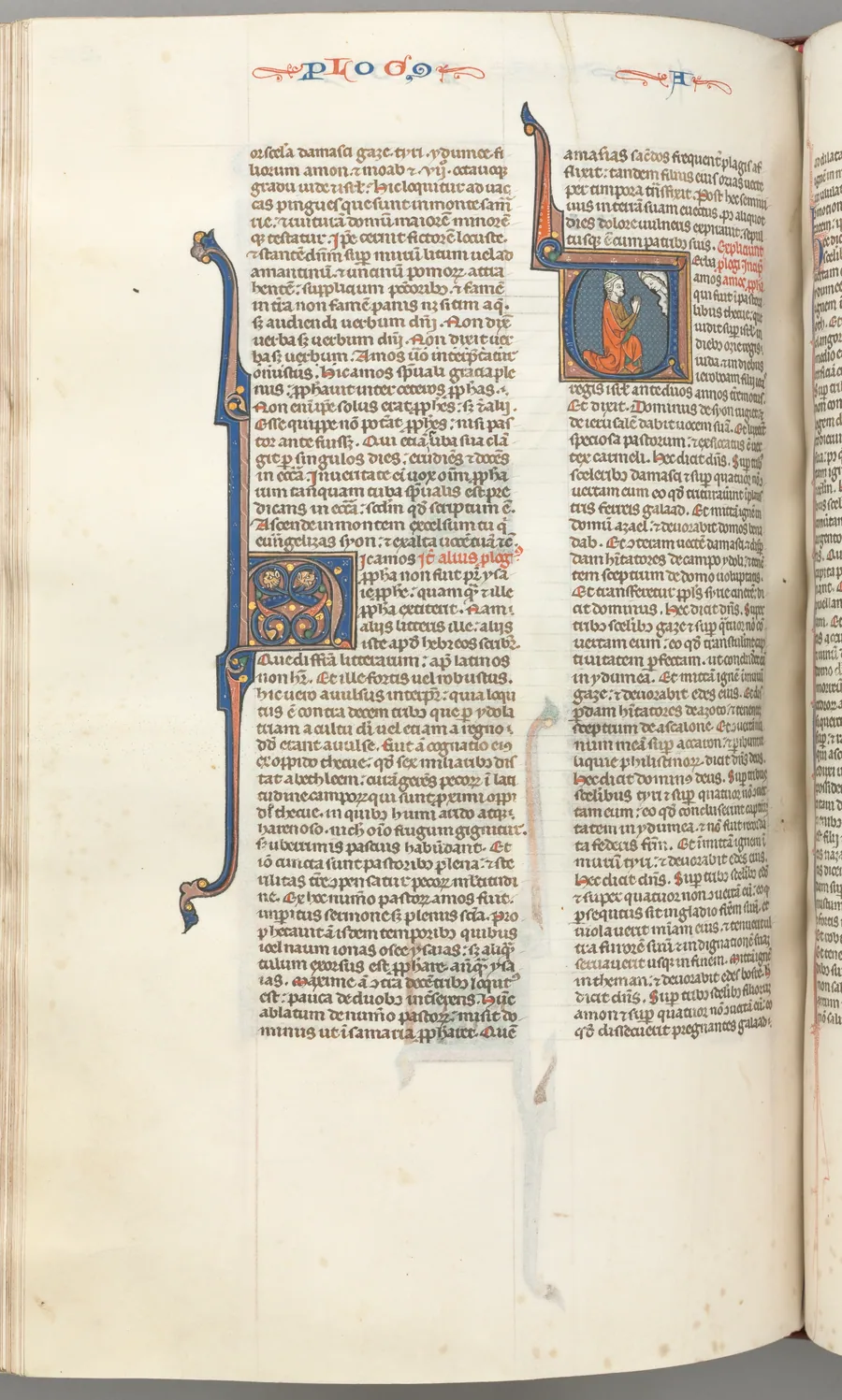 Fol. 354v, Amos, historiated initial V, Amos kneeling in prayer, bust of God above