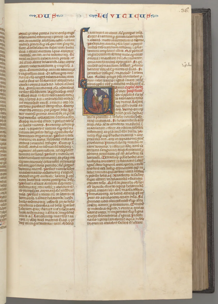Fol. 36r, Leviticus, historiated initial V, Moses offering a sacrificial lamb on an altar