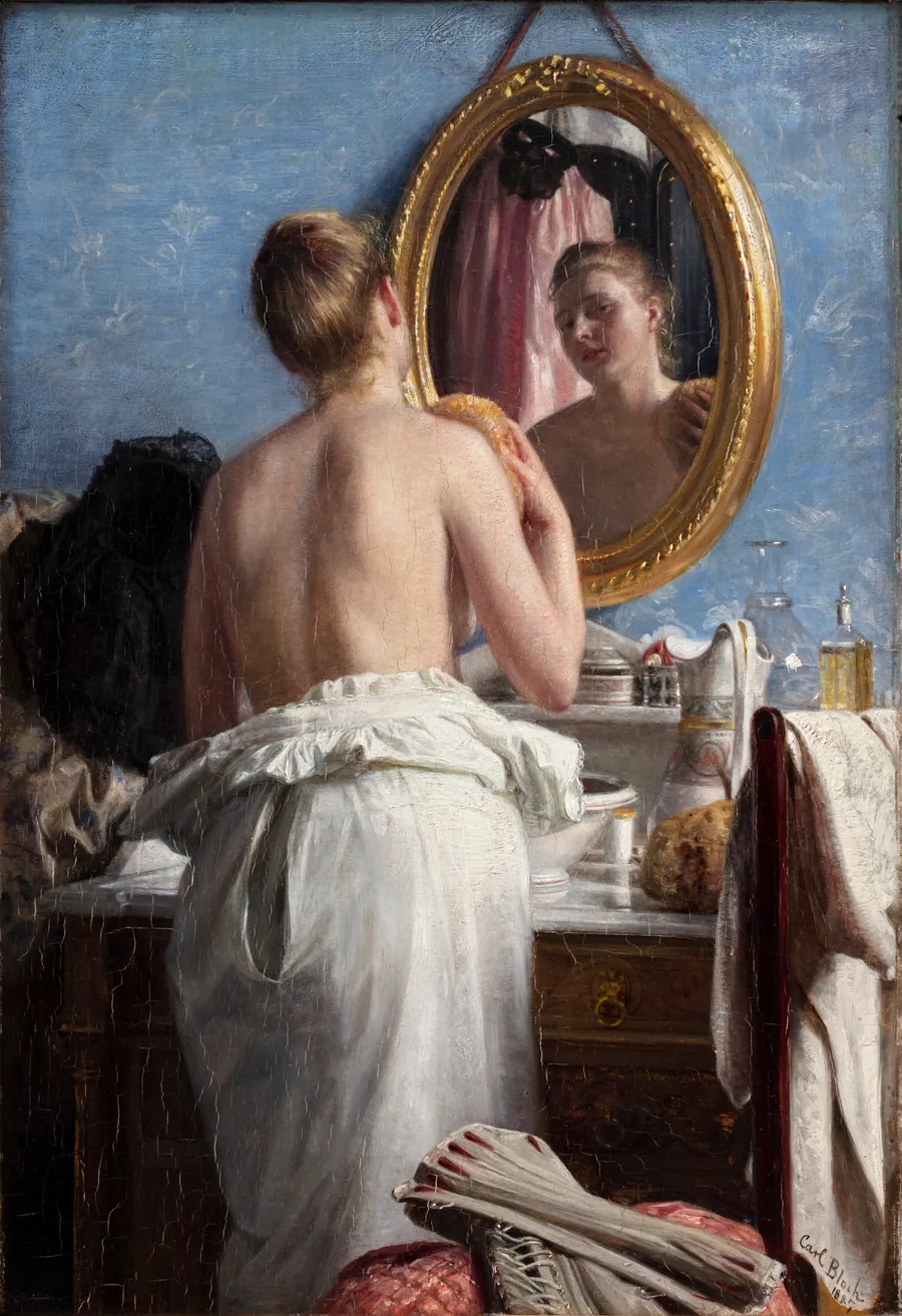 En pige, som vasker sig før et karneval by Carl Bloch