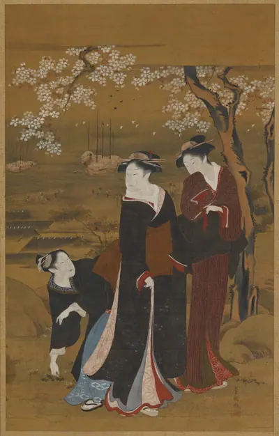 Three women under a flowering cherry tree at the seashore