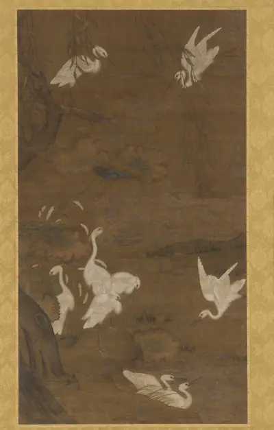 Nine white egrets and a willow tree
