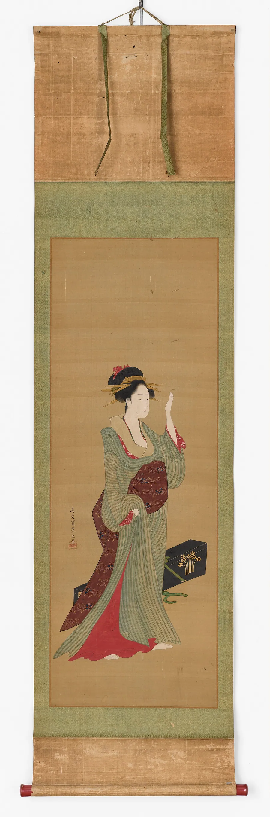 A geisha about to adjust a tortoise-shell hairpin by Chobunsai Eishi 鳥文斎栄之 (1756-1829)