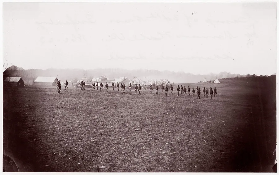 Camp of 34th Massachusetts Infantry, Miner's Hill, VA.  Skirmish Drill. by Mathew B. Brady