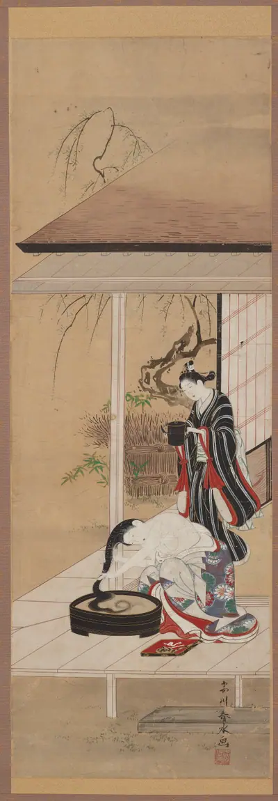 Woman washing her hair with an attendant