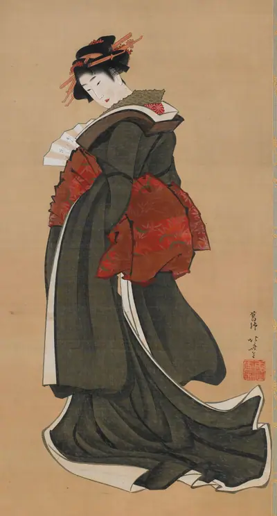 Woman holding a fan