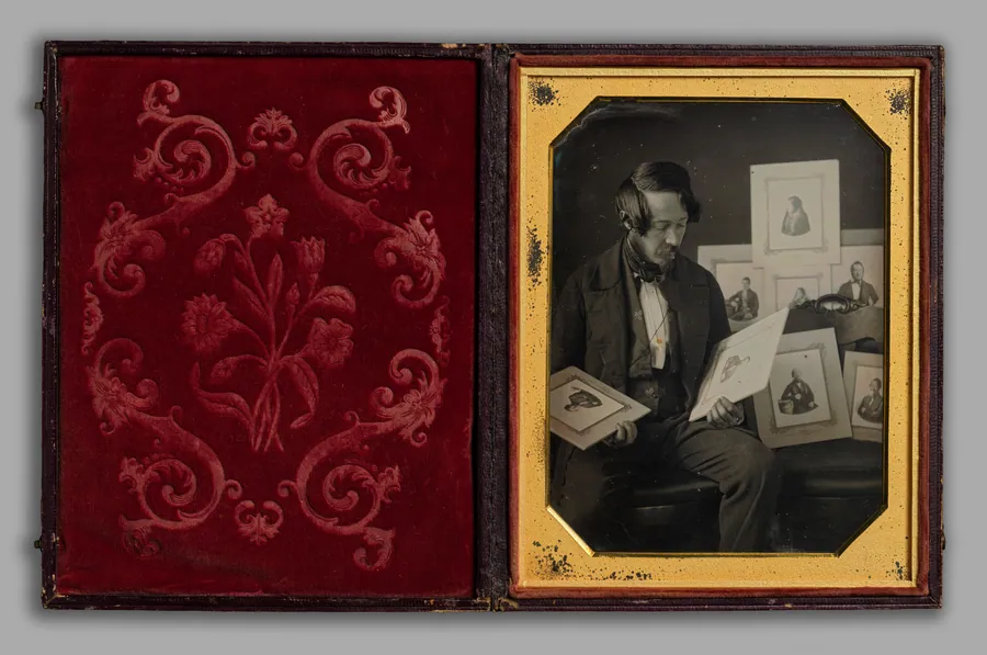 Frederick Langenheim Looking at Talbotypes by W. & F. Langenheim