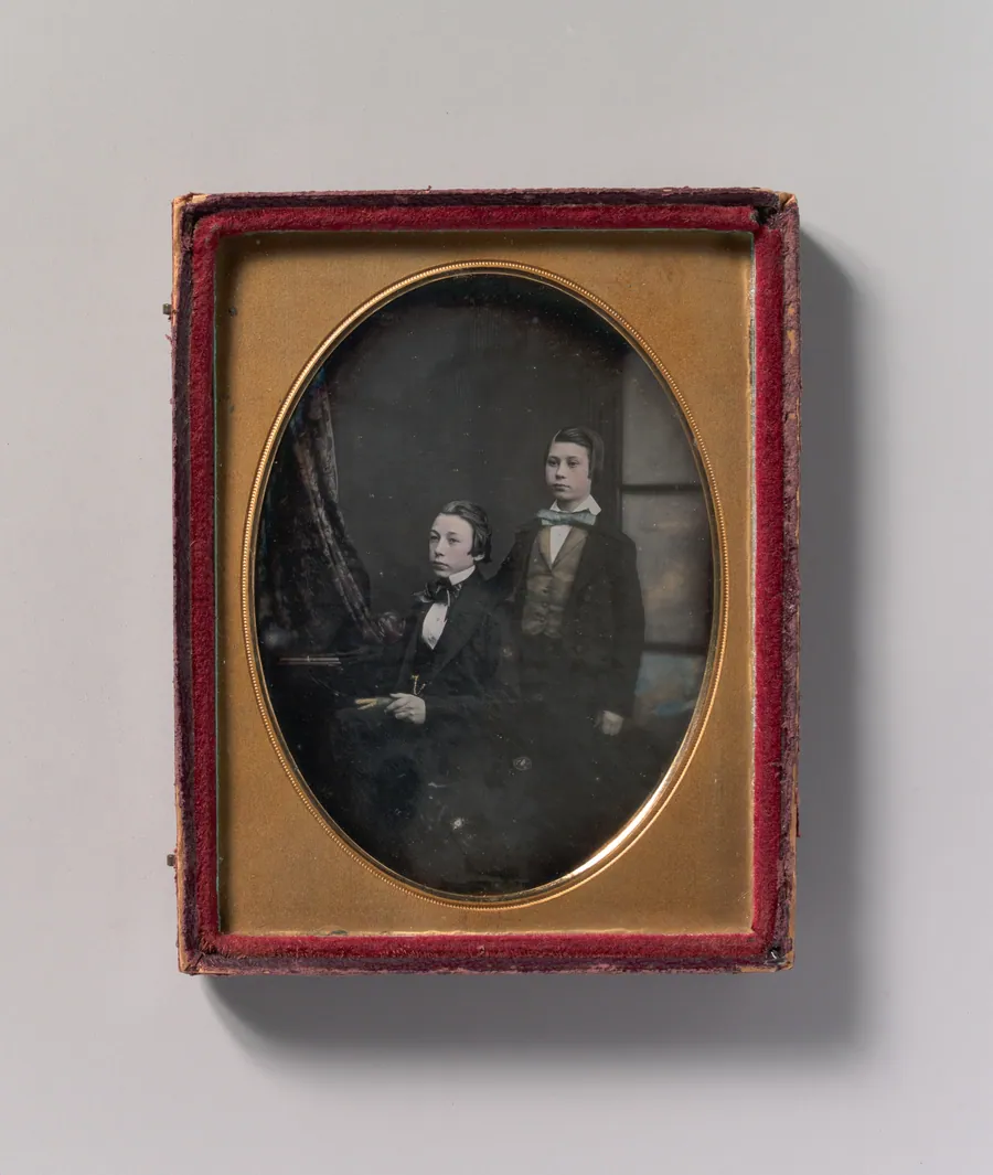 [Two Young Men in Bow Ties, One Seated Holding a Book, One Standing] by Robert Boning