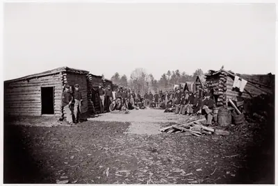 [Winter Quarters, troops with row of cabins].  Brady album, p. 128