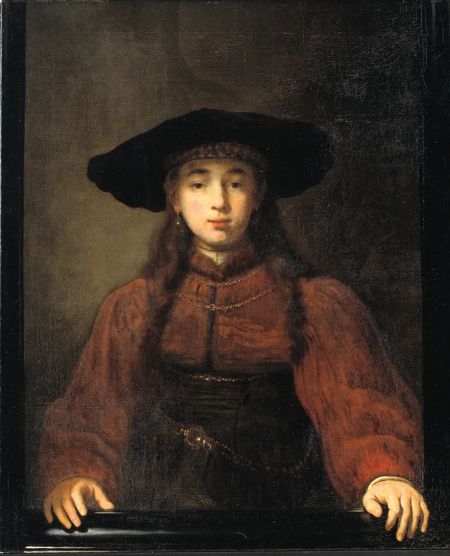 En ung kvinde med hænderne hvilende på billedrammen by Rembrandt van Rijn (værksted)